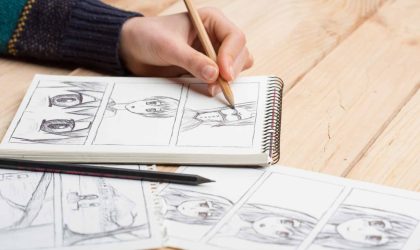 artist drawing an anime comic book in a studio.